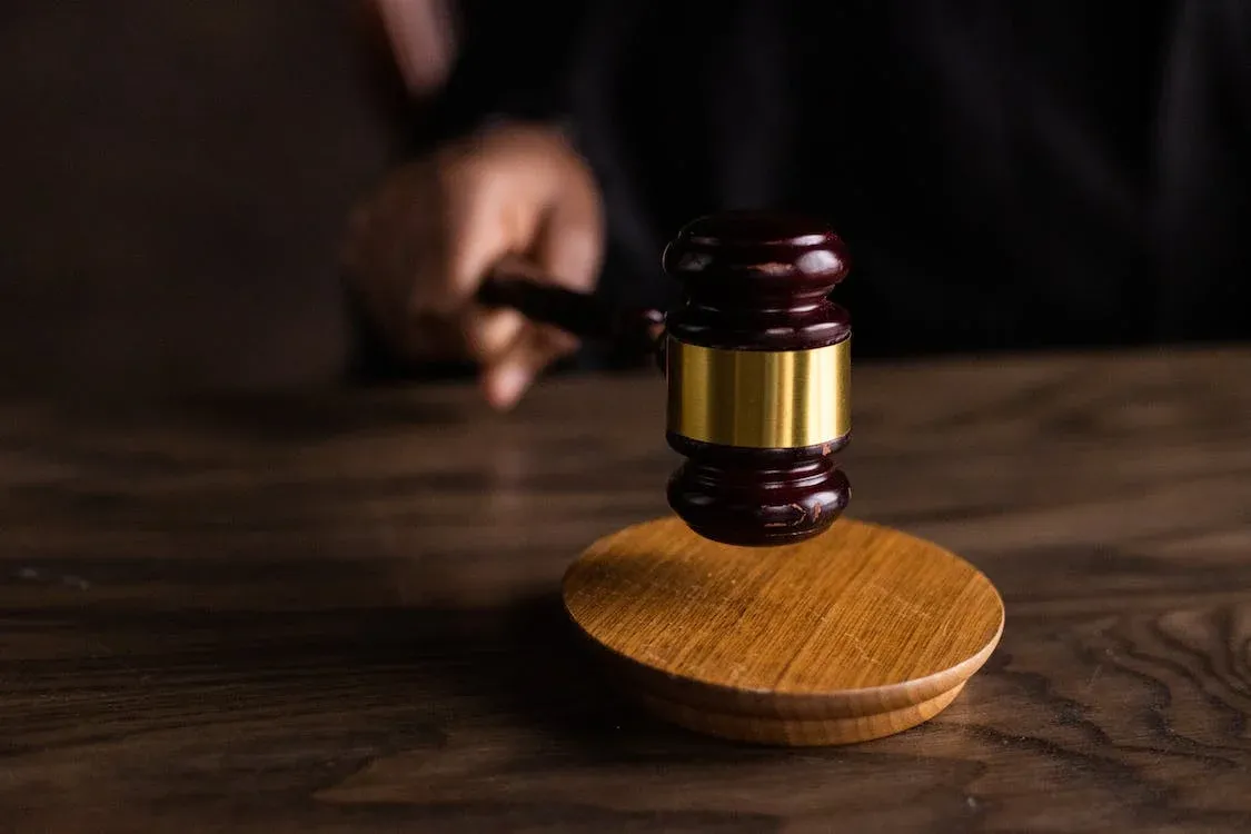 stock image of gavel being used in court room.